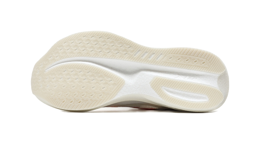 Outsole view of white low-top running shoe with textured tread and cushioned midsole.