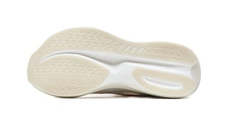 Outsole view of white low-top running shoe with textured tread and cushioned midsole.