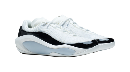 White and black basketball shoe, three-quarter side view with lace-up