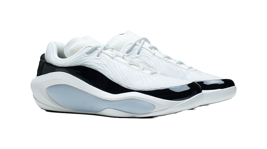White and black basketball shoe, three-quarter side view with lace-up