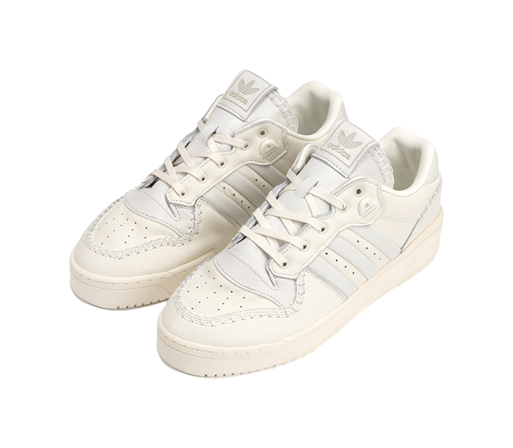 Ecru low-top Adidas Campus sneakers, front view with lace-up and stitching details