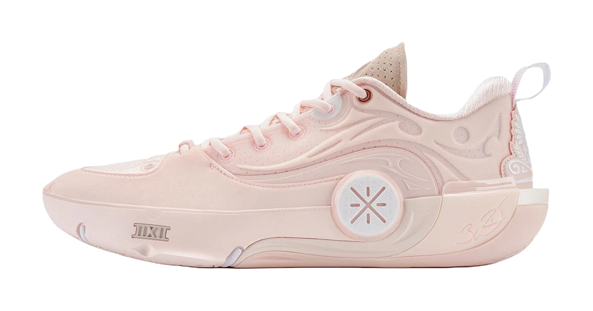Pink lace-up basketball shoes with molded side panels and chunky rubber sole