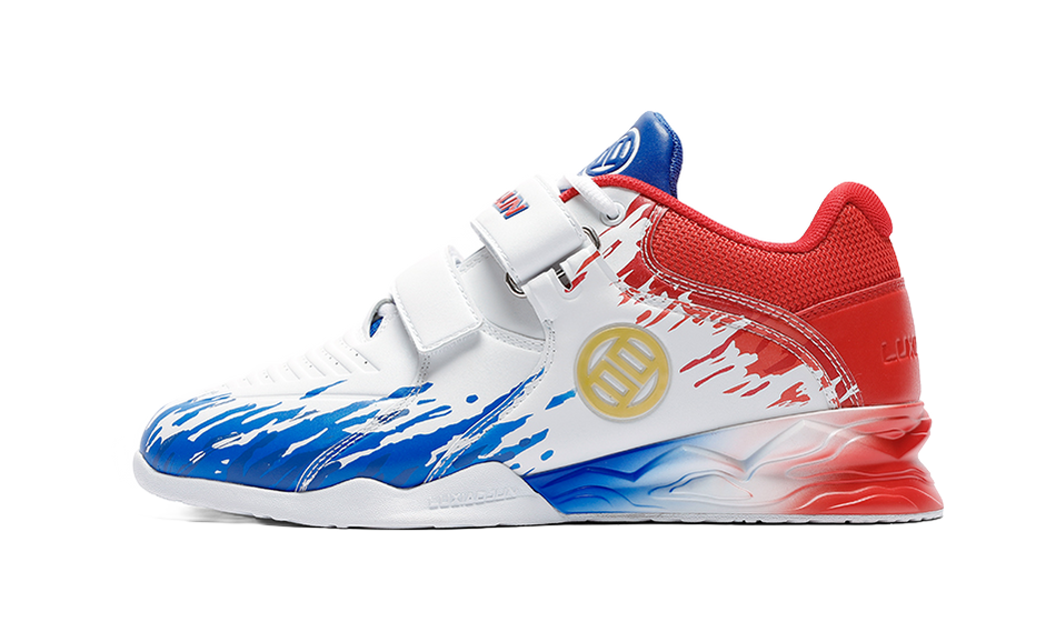 White low-top training shoes with blue and red accents, hook-and-loop strap