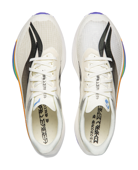 Pair of champagne white running shoes with white laces and black side stripes