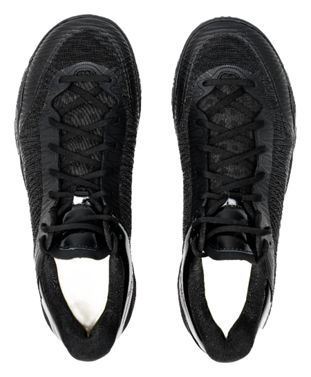 Black low-top basketball shoes, front view with laces and padded tongue.