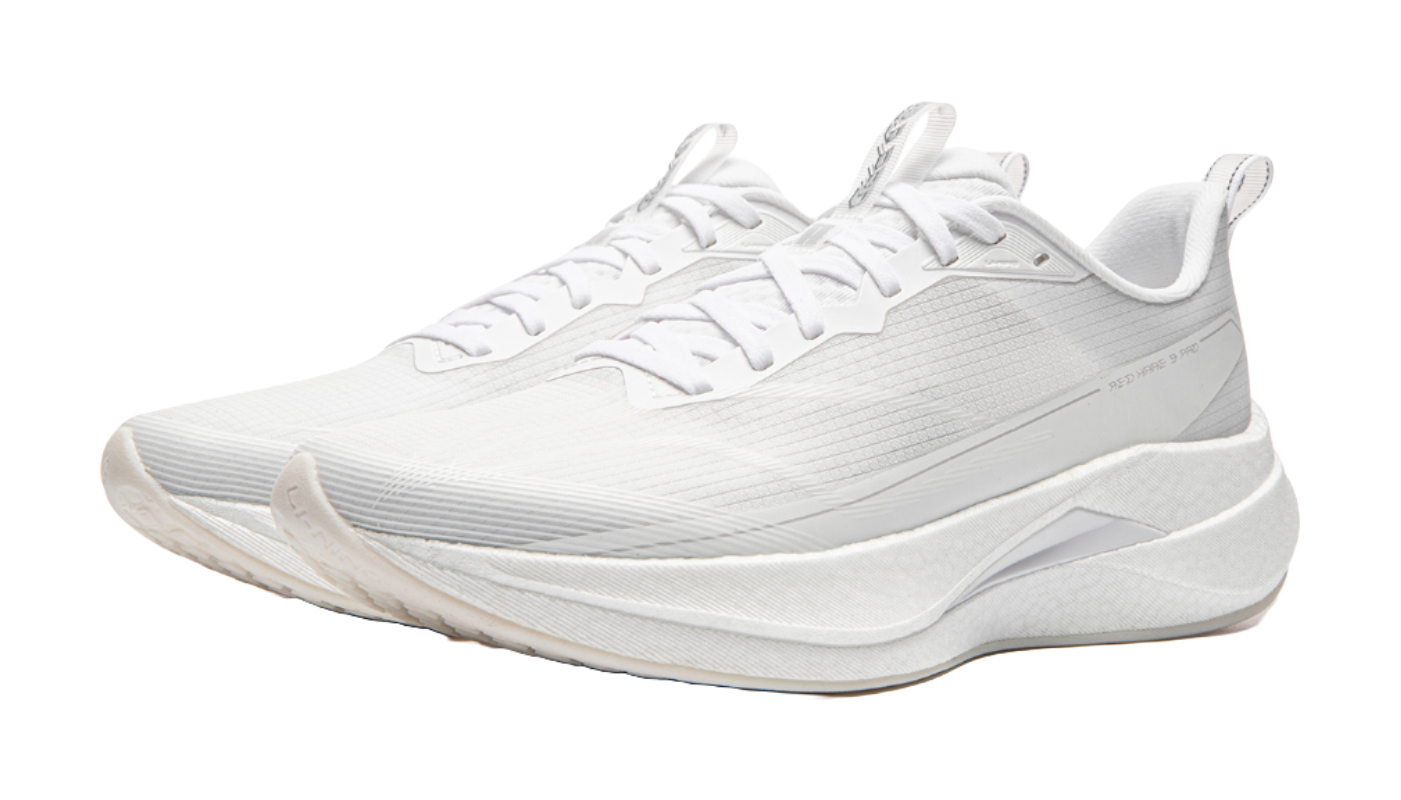 White running shoe with lace-up front and thick rocker-style sole