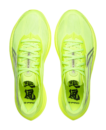 Neon yellow green running shoes, pair view, lace-up tongues and molded logos