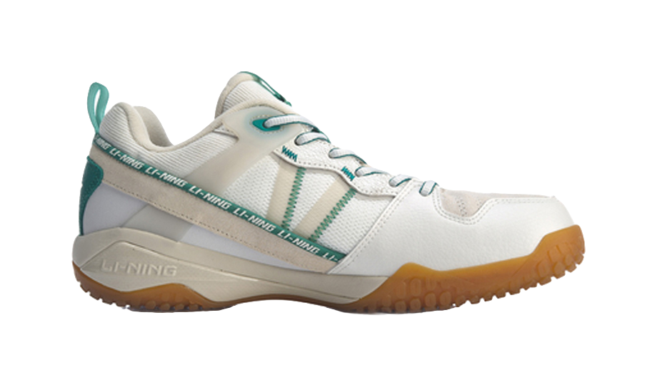 White-and-gray badminton shoe with green heel panel, lace-up and cushioned sole