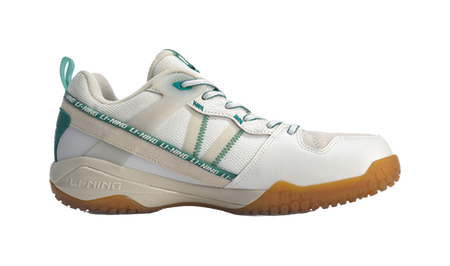 White-and-gray badminton shoe with green heel panel, lace-up and cushioned sole