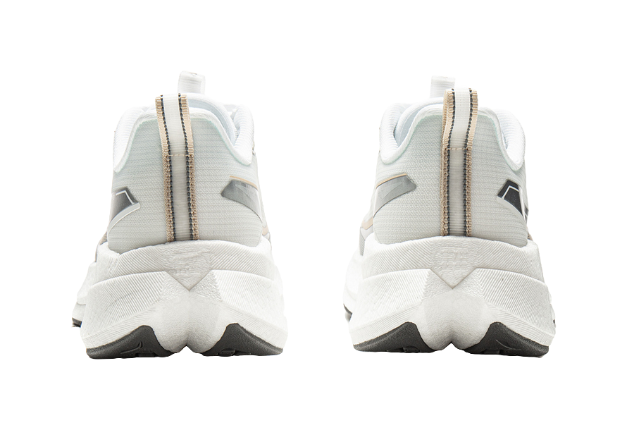 Pair of white running shoes with tall heel backs and gold-toned pull tabs.