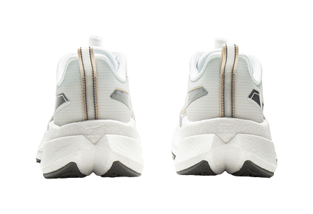 Pair of white running shoes with tall heel backs and gold-toned pull tabs.