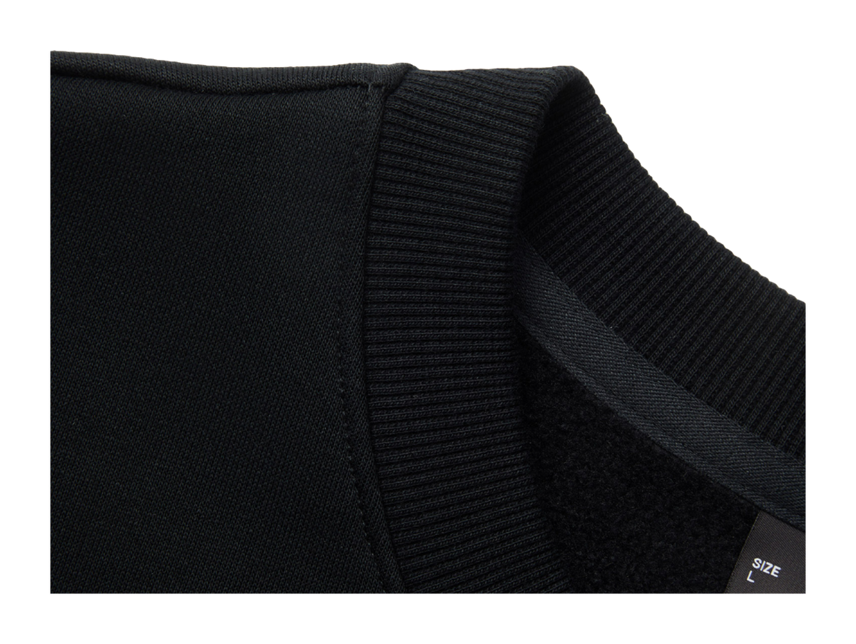 Black fleece-lined crewneck pullover cuff and ribbed hem detail