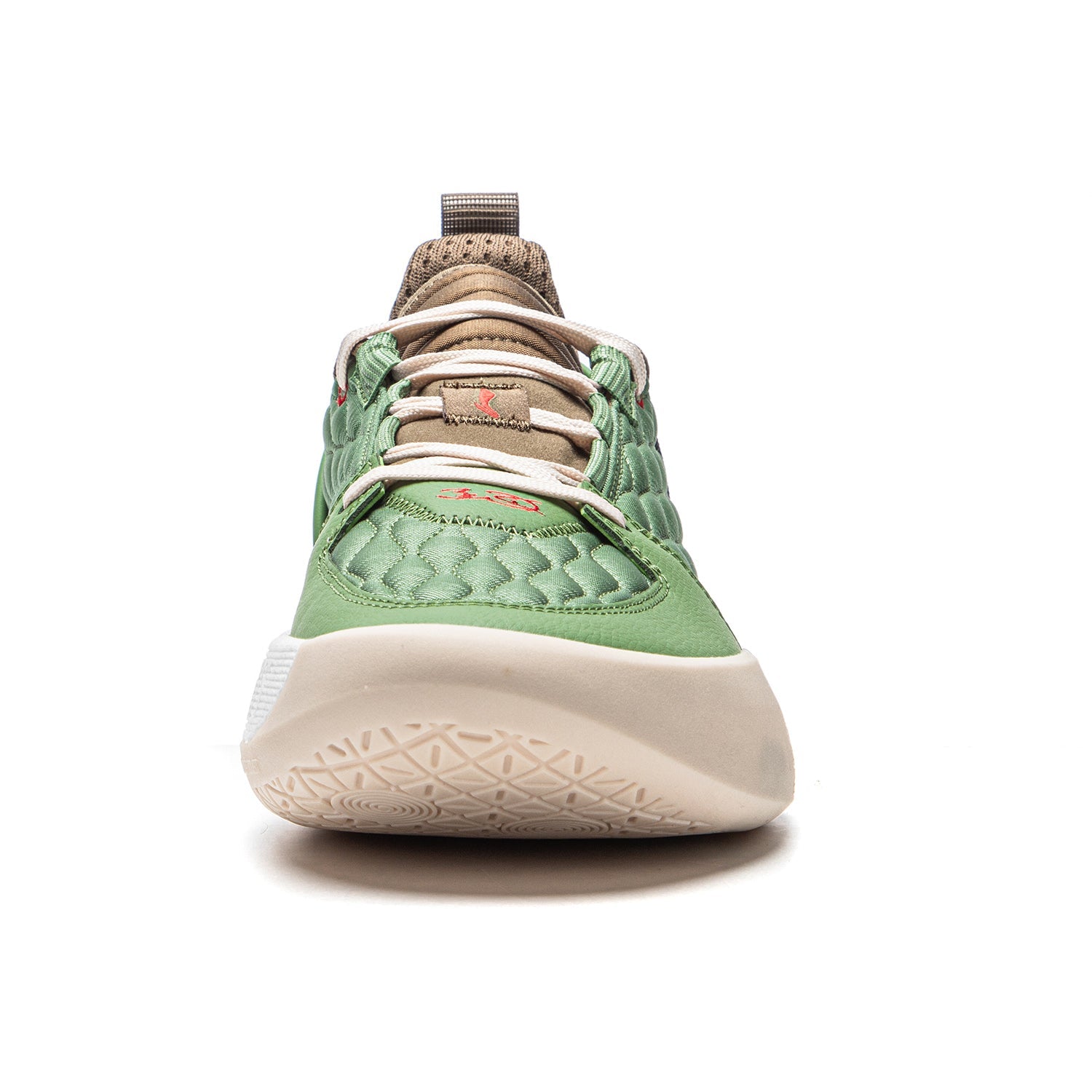 Men's basketball shoe close-up with moss green upper, brown collar, and white outsole