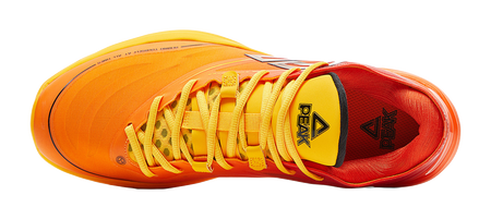 Basketball shoe with orange upper, yellow laces, and black triangular heel logo