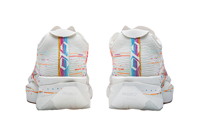 White running shoes with multicolor striping on heel and cushioned back support.