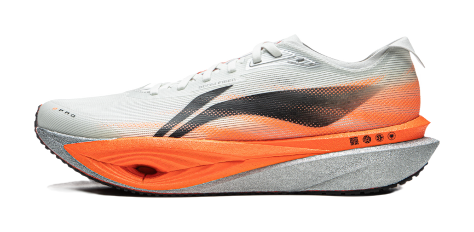 Carbon plate running shoes with white upper, dusty orange midsole, black side stripe