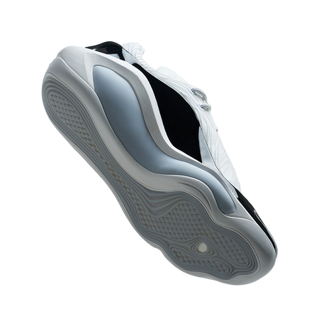 White and black basketball shoe outsole, side view with textured tread