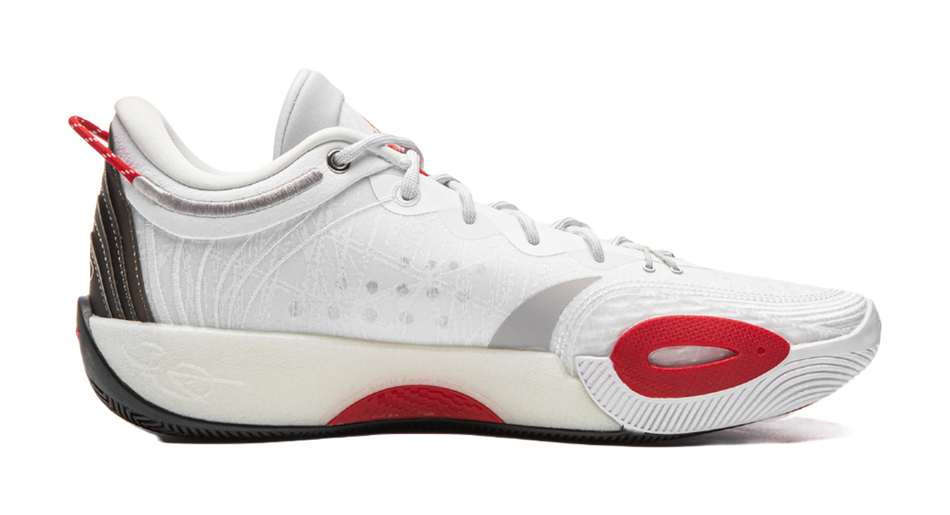 White lace-up basketball shoe with red heel tab, textured midsole, side oval logo