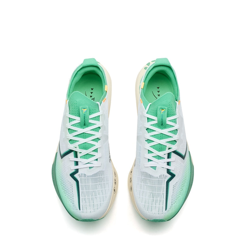 Pair of men's running shoes, white uppers with green lining and lace-up front