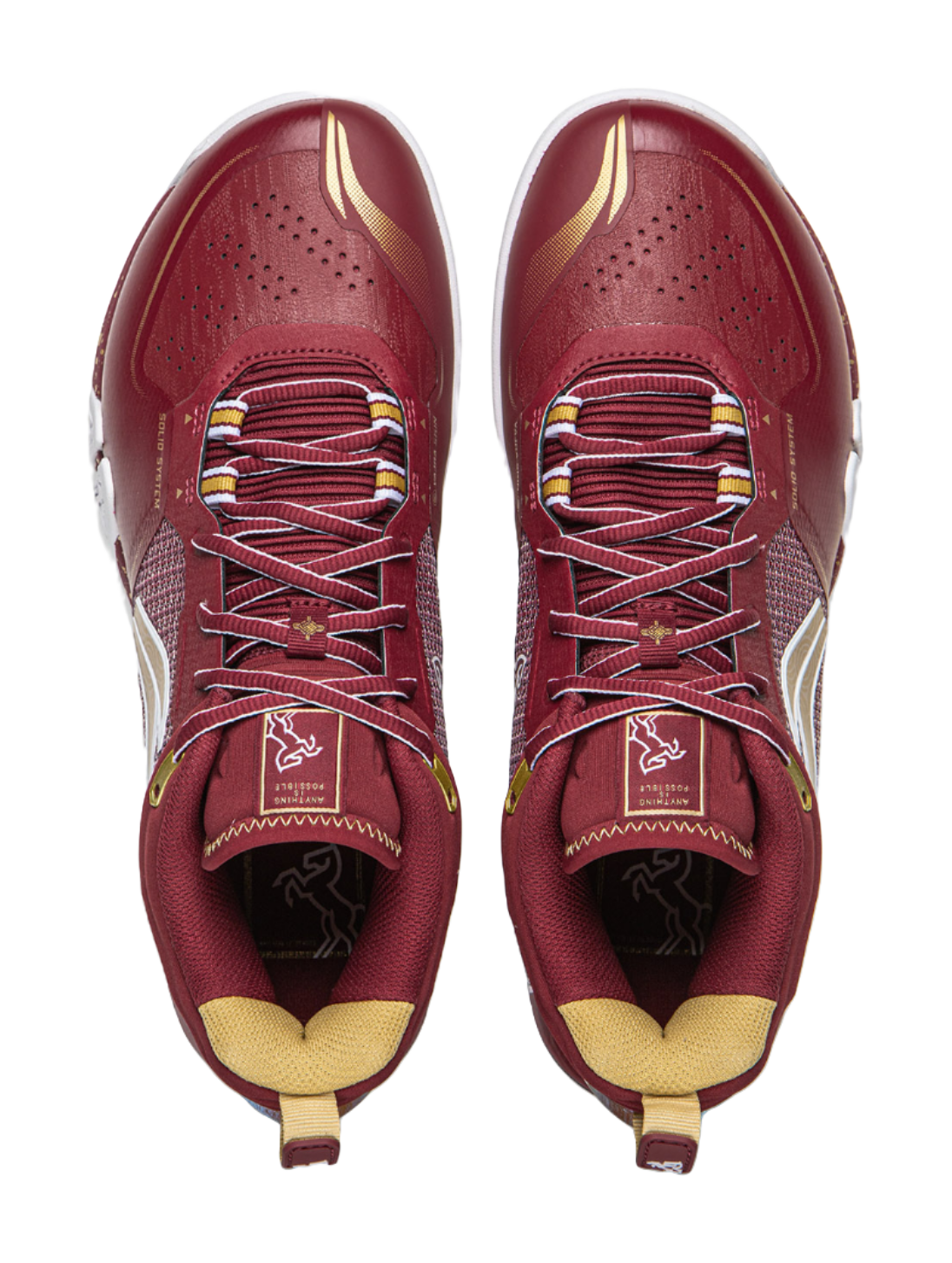 Red lace-up badminton shoe with textured toe perforations and cushioned collar.