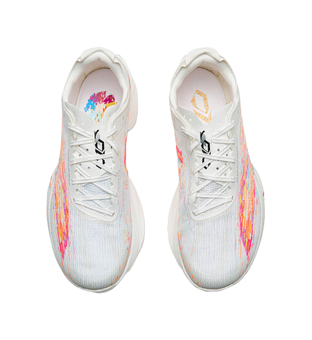 White sneakers with multicolor heel graphics and lace-up front, padded collar.