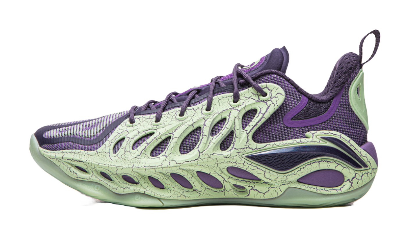 Purple and green basketball shoe with lace-up front, textured upper panels