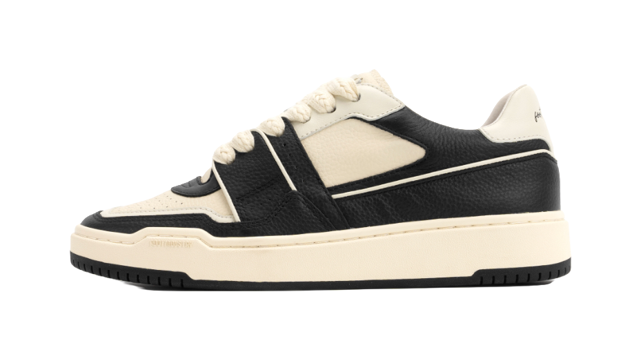 Black and white unisex skate trainer shoes with lace-up front and low profile sole