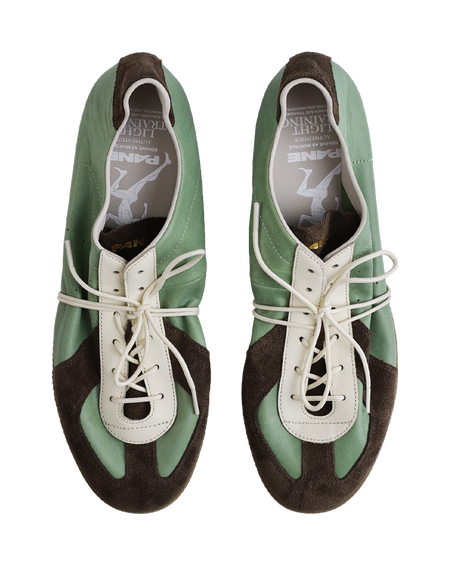 Mint and brown lace-up shoes with white laces and padded collar