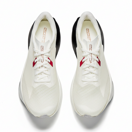 Pair of white running shoes with black heel lining, red strap detail, and lace-up uppers