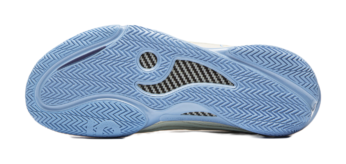 Unisex basketball shoe outsole in light blue with herringbone traction pattern.