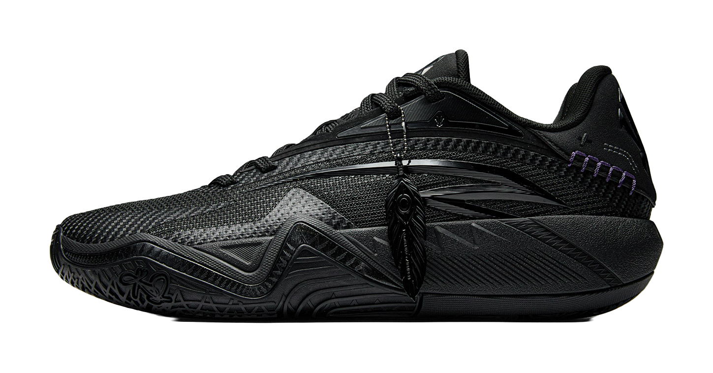 Black basketball shoe with lace-up front, mesh upper, purple trim and sculpted midsole