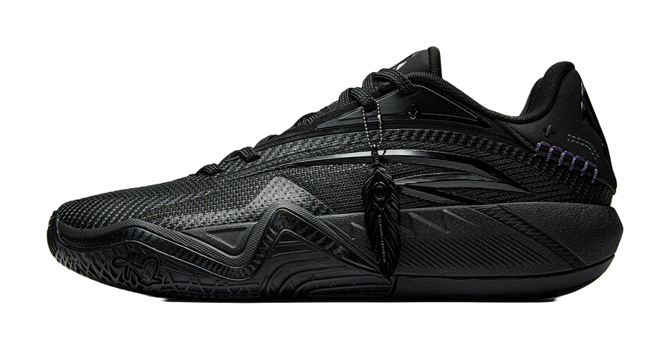 Black basketball shoe with lace-up front, mesh upper, purple trim and sculpted midsole