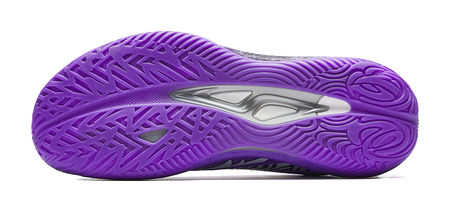 Purple basketball shoe outsole with molded tread pattern and traction side grooves.