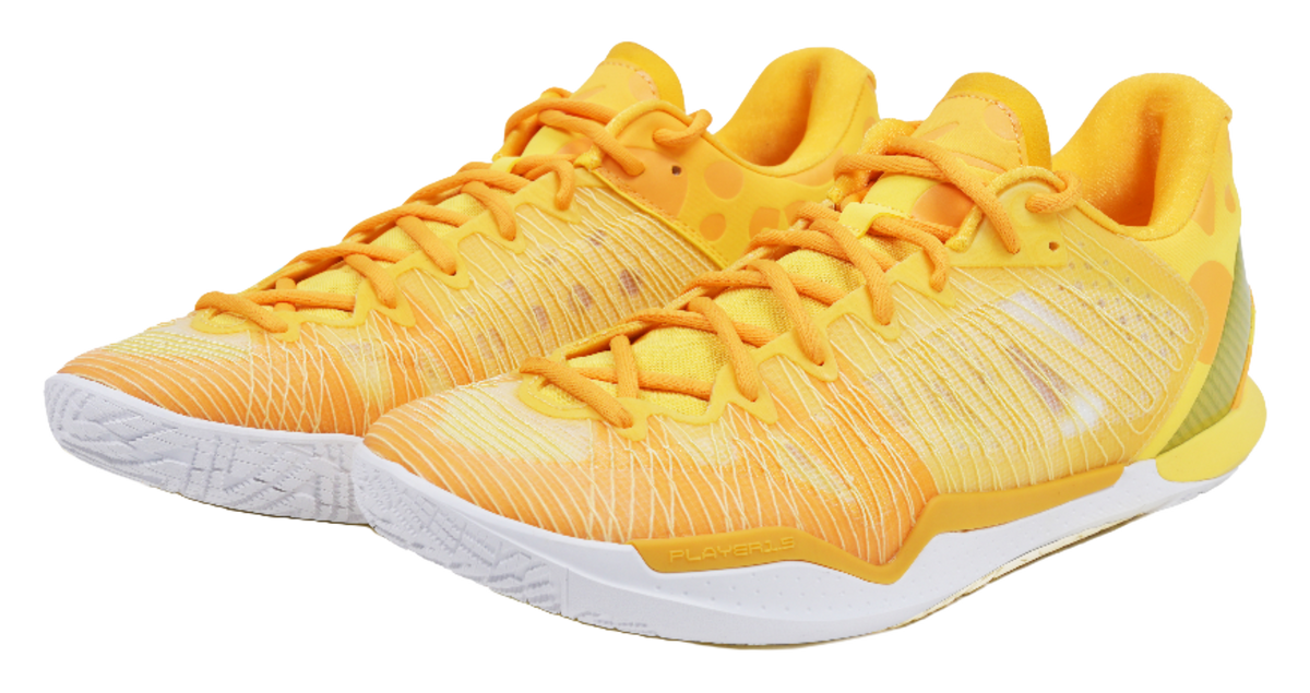 Low-top basketball shoes, front view with orange laces and textured knit upper
