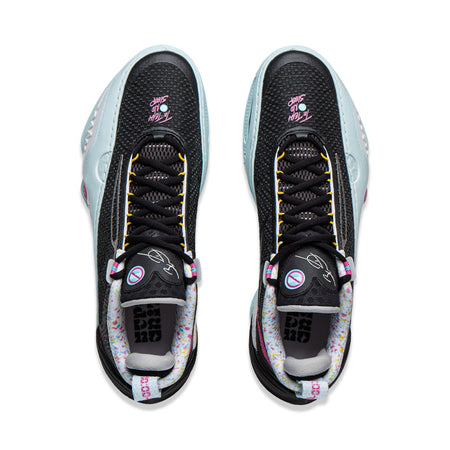 Basketball shoe pair from above: black mesh upper with yellow laces and light blue trim.
