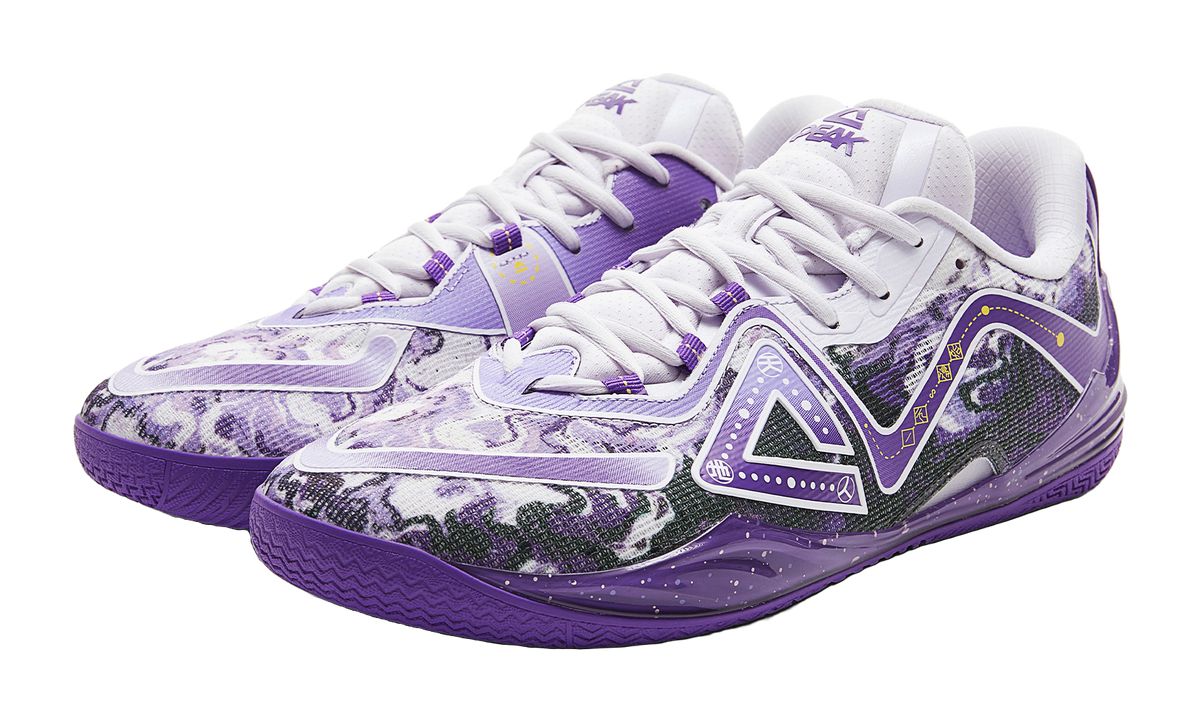 Pair of lavender basketball shoes with white laces and patterned uppers