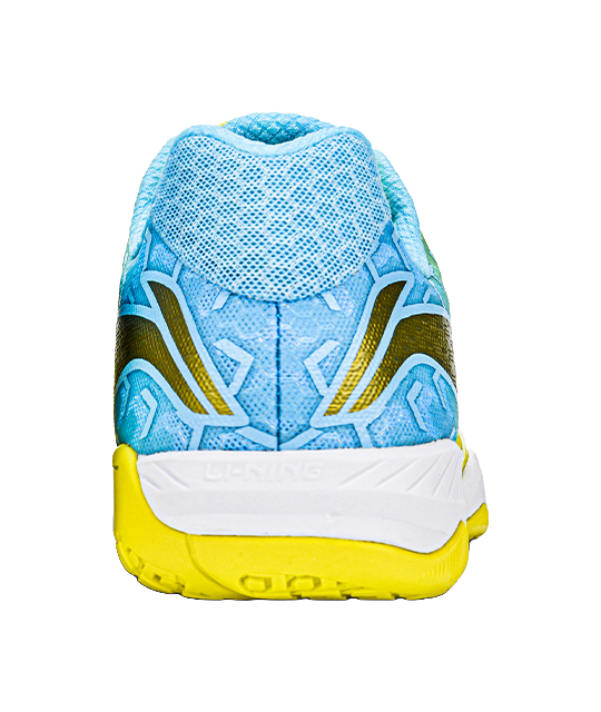 Back view of yellow and blue table tennis shoe with white heel panel