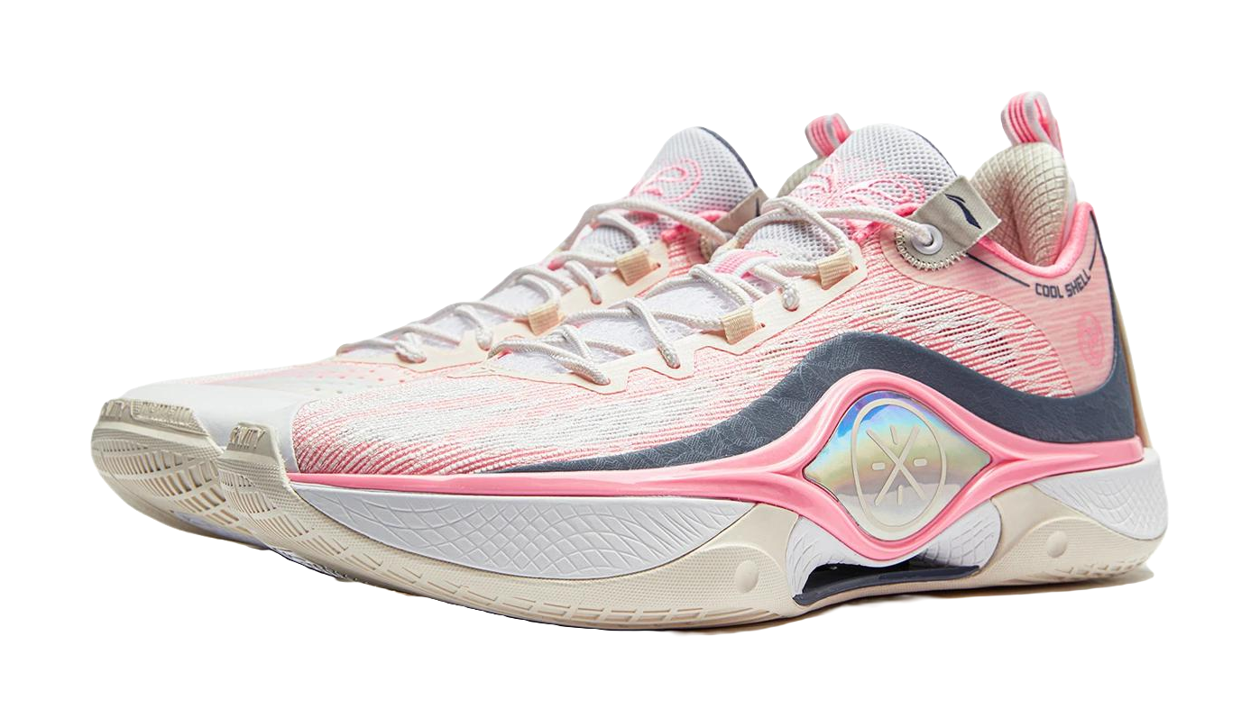 Basketball shoe in white and pink with dark blue overlays and arched forefoot stripe