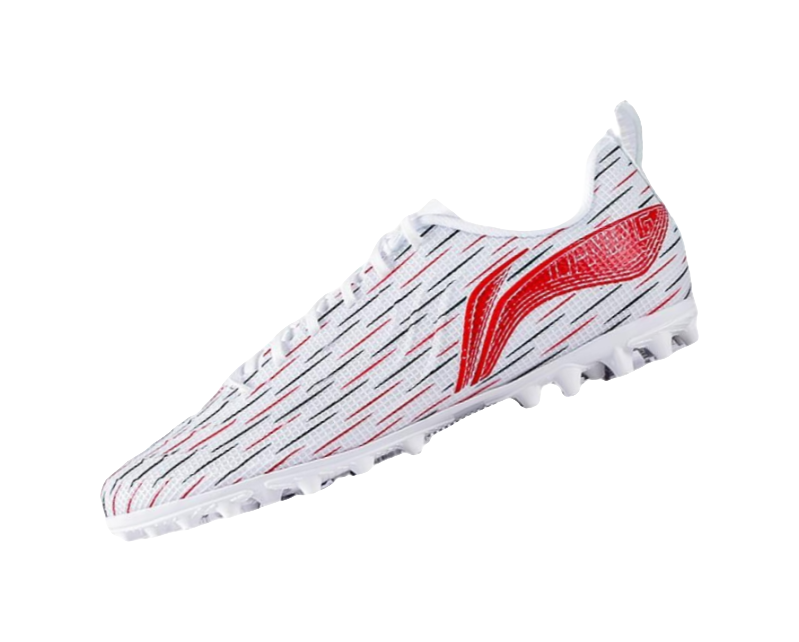 Youth soccer shoe angled view: white patterned upper with red flame wing