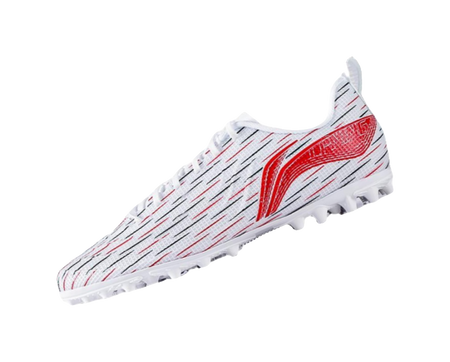 Youth soccer shoe angled view: white patterned upper with red flame wing