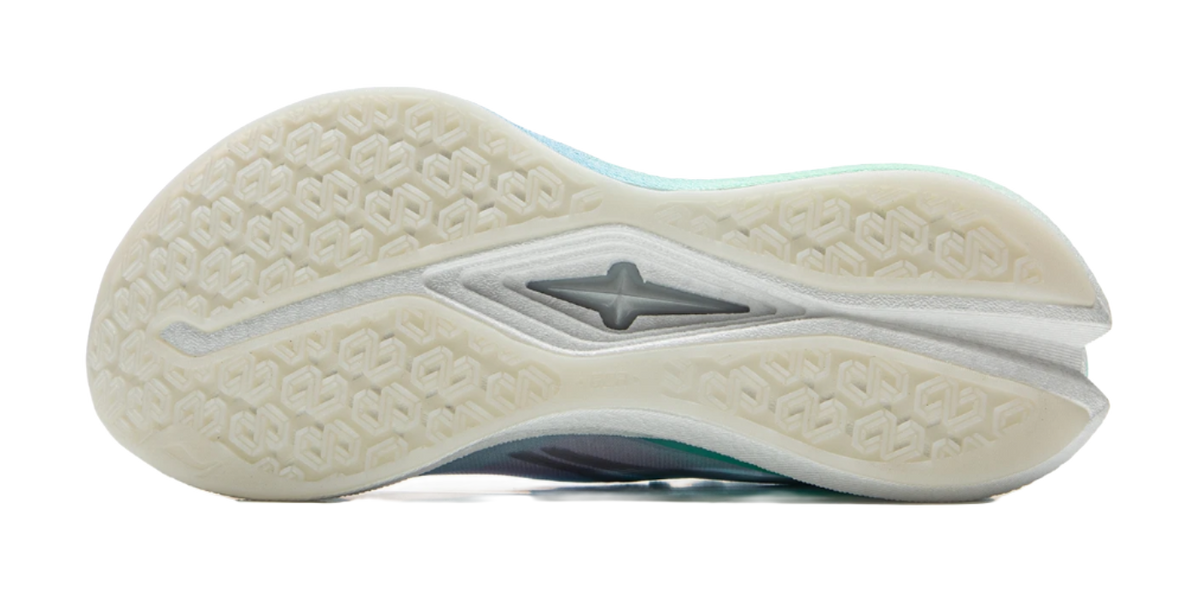 White rubber outsole for running shoe with star logo and textured tread.