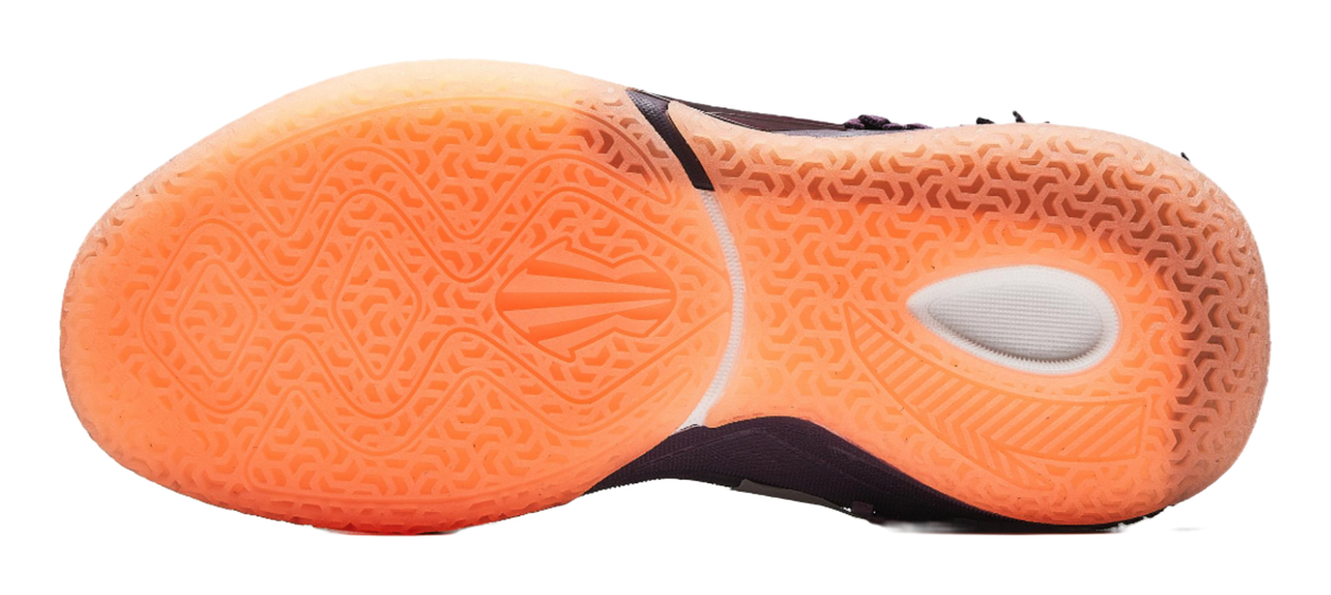 Purple basketball shoe outsole view, orange rubber traction tread with circular vent