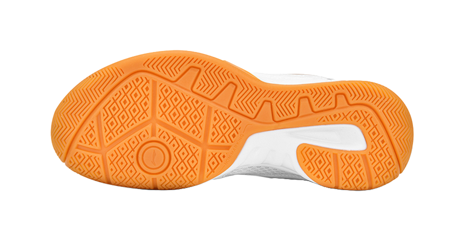 Orange and white badminton shoe outsole with patterned rubber grip tread