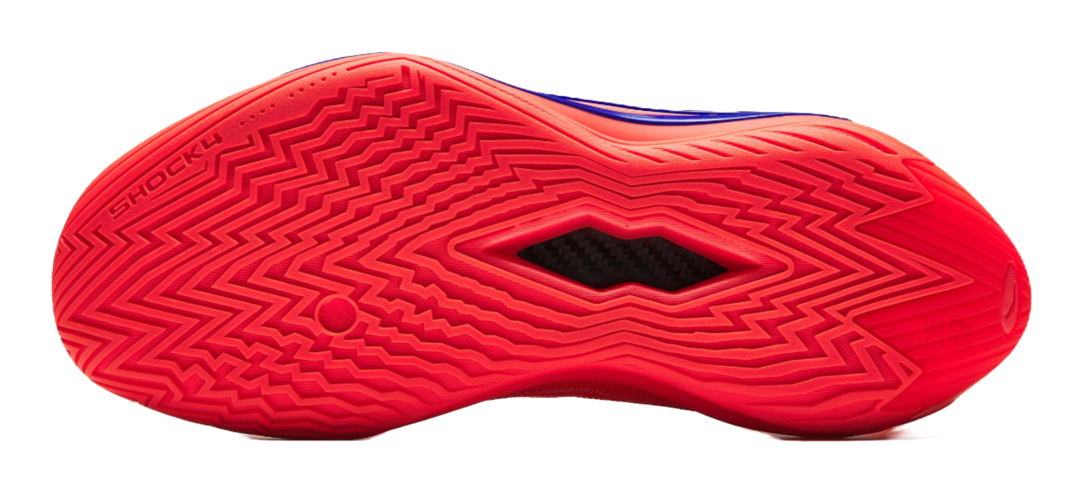 Red basketball shoe outsole close-up with zigzag tread pattern and brand text