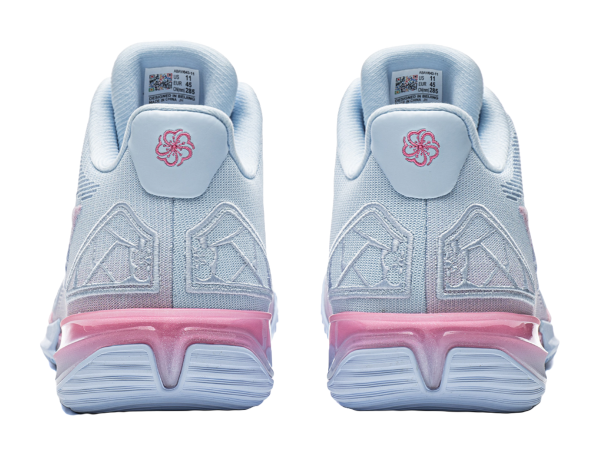 Men's basketball shoe heel view, light blue with pink cushioning and logo tab