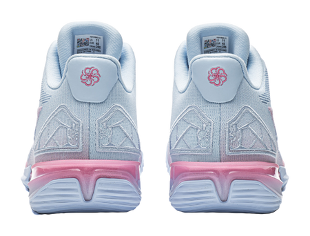 Men's basketball shoe heel view, light blue with pink cushioning and logo tab