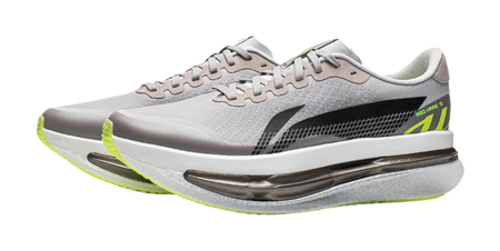 Men's low-top running shoes with gray textured mesh, black side, and lime outsole edge