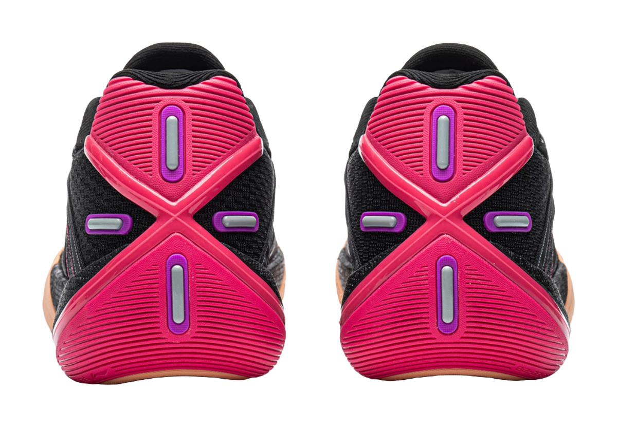 Low basketball shoes heel view: black uppers with pink pods and molded heel panels.