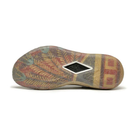 Khaki basketball shoe outsole view with patterned tread and geometric side patch