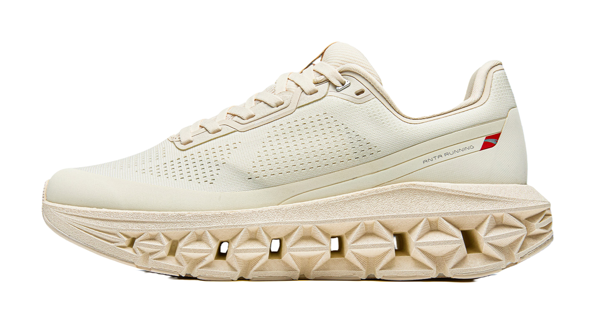 Women’s Anta running shoes in vanilla white, perforated upper, lace-up with cushioned sole.